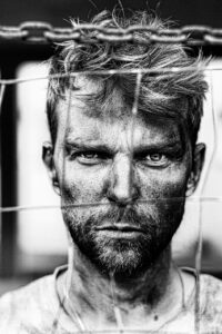 man, refugee, escape, security, migration, male, help, human, rights, prison, camp, immigrant, war, revolution, soldier, portrait, prisoner, face, serious, hope, warrior, fighter, black and white, gray hope, gray help, gray security, gray human, gray prison, gray camping, gray war